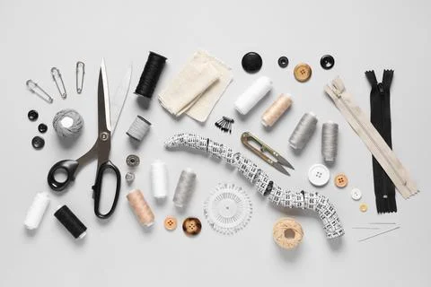 Set of thread spools with fabric, measuring tape, scissors and sewing supplie Stock Photos