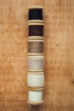 Set of thread on wooden background with copy space for your texture backgroun Stock Photos
