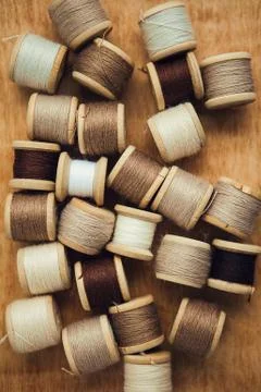 Set of thread on wooden background, flat lay Stock Photos