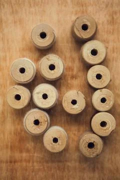 Set of thread on wooden background, flat lay Stock Photos