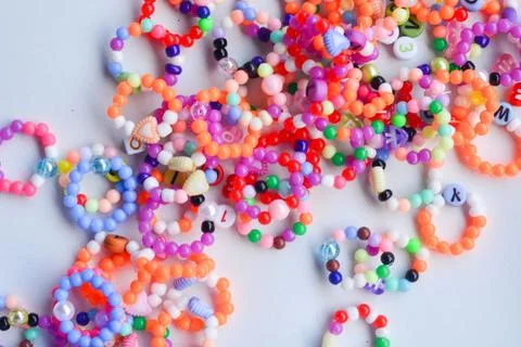 Set of three beaded children bracelets on a white background closeup Stock Photos