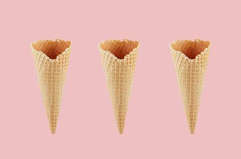 Set of three empty crisp ice cream cones on pink background, mock up for adve Stock Photos