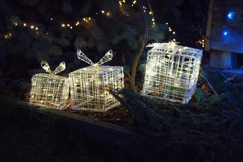 A set of three LED gift boxes of different sizes that create festive lighting Stock Photos