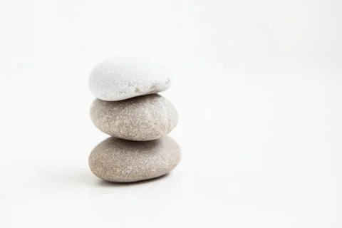 Set of three pebbles on the white background Stock Photos