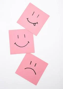 Set of three pink sticky notes with different smiley faces Stock Photos