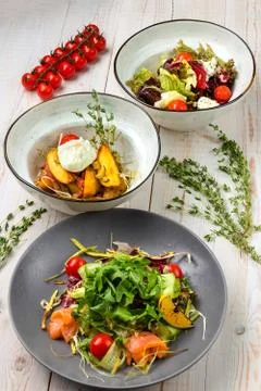 Set of three plates with vegetable salad. Healthy food for dieting. Lunch men 库存照片