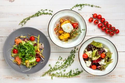 Set of three plates with vegetable salad. Healthy food for dieting. Lunch men 库存照片