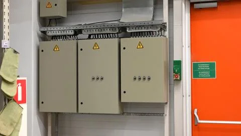 A set of three switching panels with three-phase output control. Stockfoto's