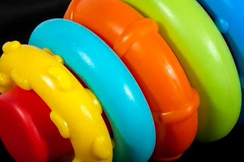 Set of Toddler's Bright Colored Plastic Rings in Varying Sizes Stock Photos