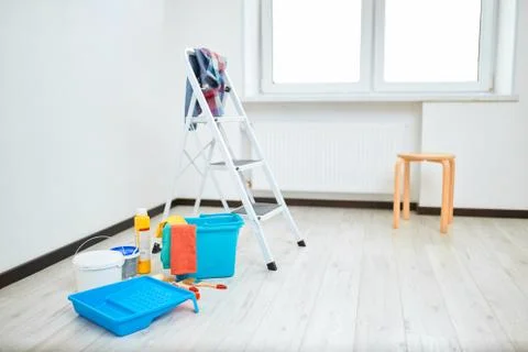 Set of tools and paints for making repair in appartments against white wall Stock Photos
