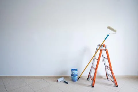 Set of tools and paints for making repair in flat, interior, white bricks wall Stock Photos