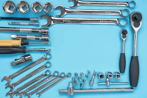 Set of tools and wrenches for auto repair on a blue background. Copy space Stock Photos