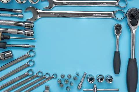 Set of tools and wrenches for auto repair on a blue background, top view Stock Photos