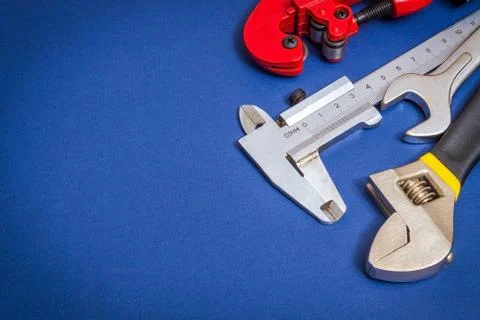Set of tools on blue background prepared by professional master before repair Stock Photos