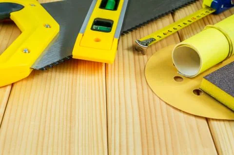 Set of tools for the Builder on a wooden background with a place for advertis Stock Photos