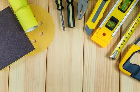 Set of tools for the Builder on a wooden background with a place for advertis Stock Photos