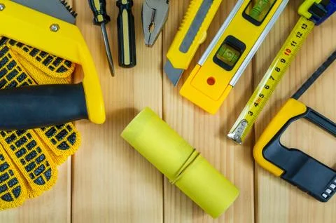 Set of tools for the Builder on a wooden background with a place for advertis Stock Photos