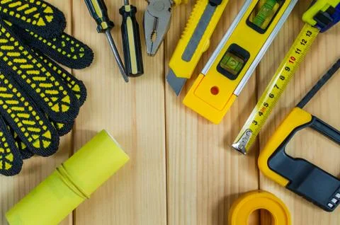 Set of tools for the Builder on a wooden background with a place for advertis Stock Photos