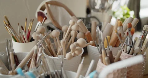Set of tools for crafting, texturizing or sculpting clay in pottery workshop Stock Footage 154356554