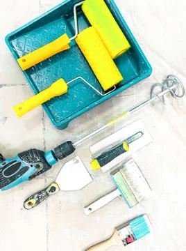 Set of tools for decorator work on a tile background 写真素材