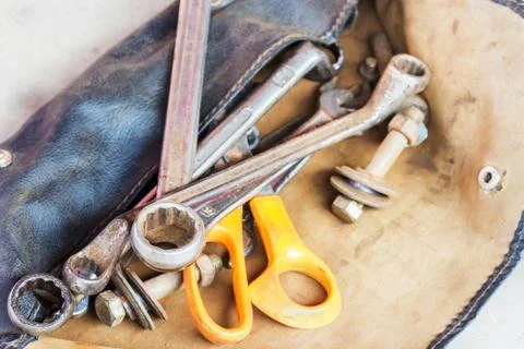 Set of tools in old leather bag Stock Photos