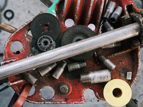Set of tools over a metal panel and pipes Stock Photos
