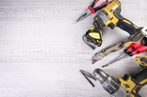 Set of tools over a wood panel! Two cordless drills! Stock Photos