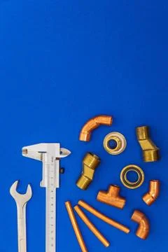 Set of tools for plumbing isolated on blue background with space for advertis Stock Photos