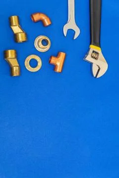 Set of tools for plumbing isolated on blue background with space for advertis Stock Photos