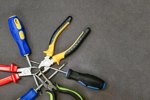 Set tools red yellow black pliers iron screwdriver blue copy space design bas Stock Photos