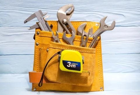 Set of tools in suede bag for master plumbers on blue wooden boards Stock Photos
