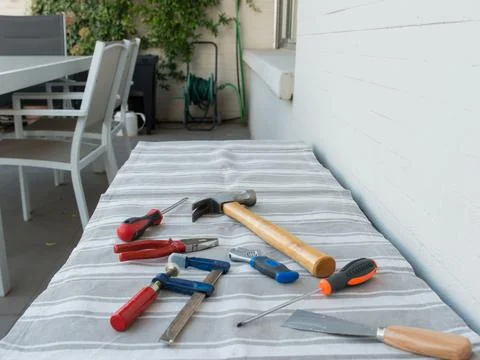 Set of tools on a terrace table Stock Photos