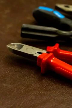 Set tools vertical pattern red pliers on the background of screwdrivers repai Foto stock