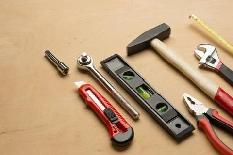 Set of tools on a wood panel Foto stock