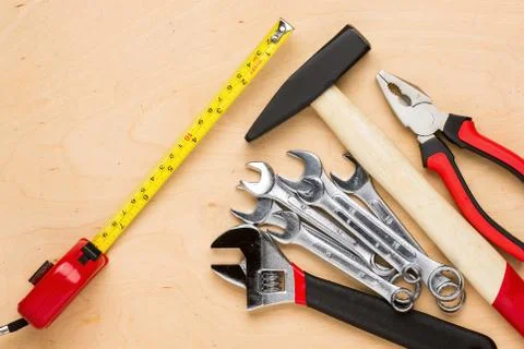 Set of tools on a wood panel Foto stock
