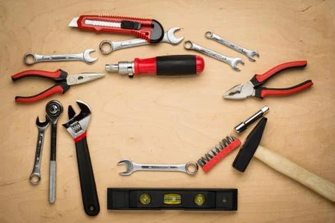 Set of tools on a wood panel Foto stock