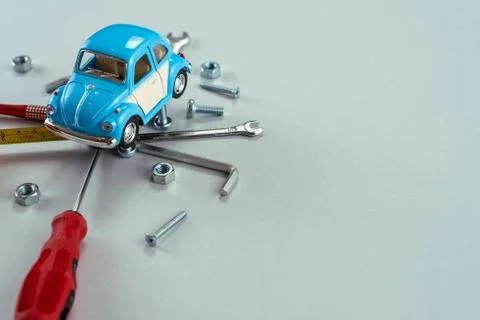 Set of tools wrenches with blue toy car. Car repair concept.  - Image Stock Photos