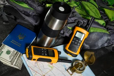 Set for the tourist: backpack, compass, card, walkie-talkie and money Stock Photos