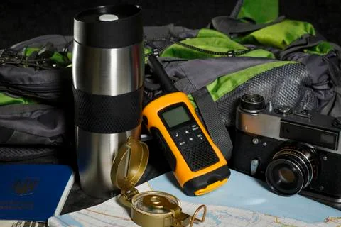 Set for the tourist: backpack, compass, card, walkie-talkie and money Stock Photos