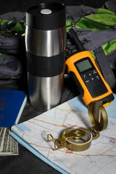 Set for the tourist: backpack, compass, card, walkie-talkie and money Stock Photos