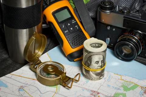 Set for the tourist: backpack, compass, card, walkie-talkie and money Stock Photos