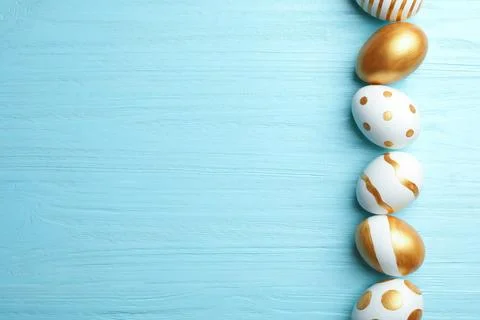 Set of traditional Easter eggs decorated with golden paint on wooden backgrou Stock Photos