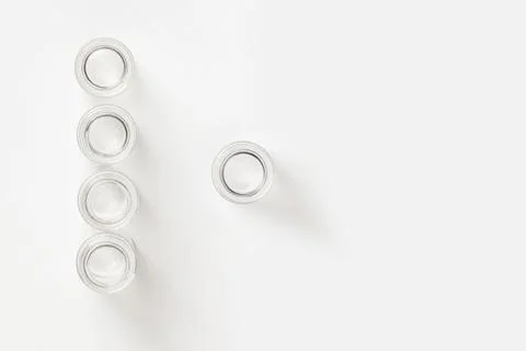 Set of transparent empty jars on a light background. Stock Photos