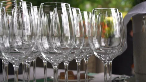 Set of transparent glasses with reflections at summer outdoor wine degustation Vidéo 129266413