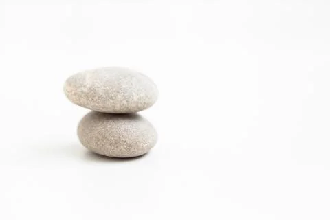 Set of two pebbles on the white background Stock Photos