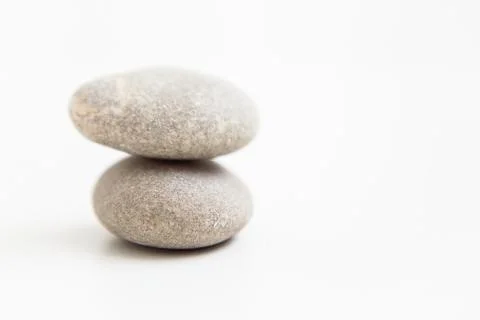 Set of two pebbles on the white background Stock Photos
