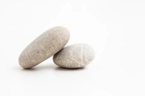 Set of two pebbles on the white background Stock Photos