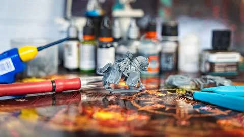 Set of utensils for cutting, assembling and painting character miniatures for Stock Photos