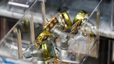 A set of variable resistor (potentiometer) in a transparent box Stock Photos