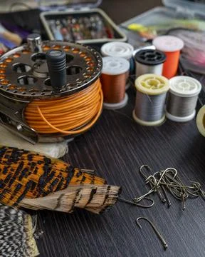 A set of various accessories and materials for tying flies for fly fishing... Stock Photos